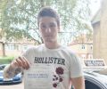 Patryk with Driving test pass certificate
